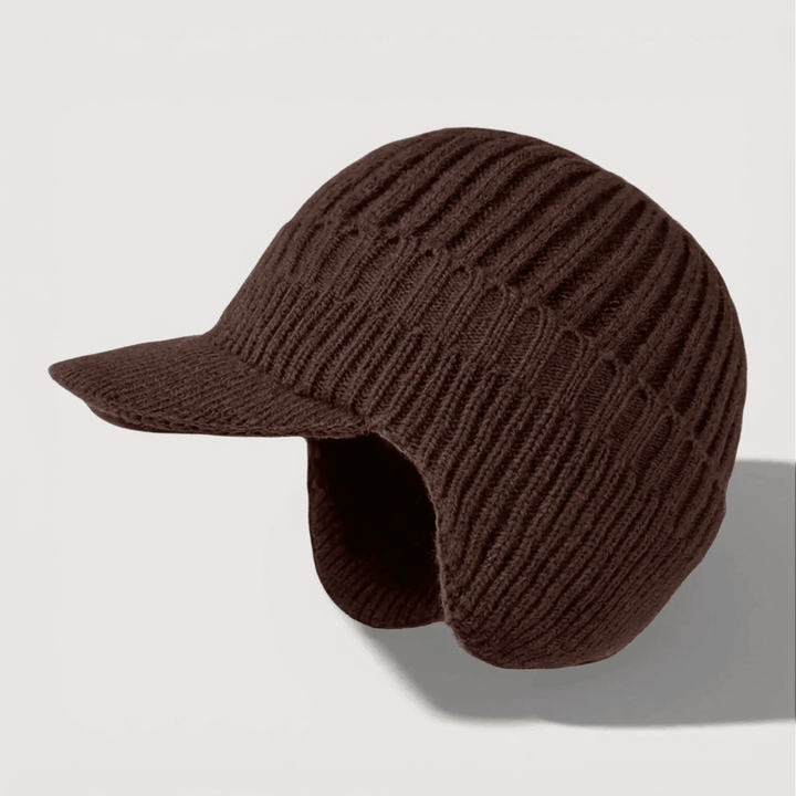 Brown knitted cap on a light gray background